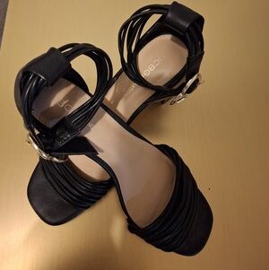 BCBGeneration Black Strappy Heels with Gold Accents